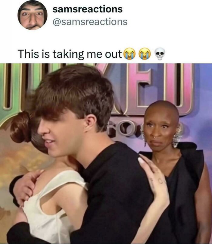A couple hugging with a woman in the background giving a disapproving look. Internet's favorite moments.