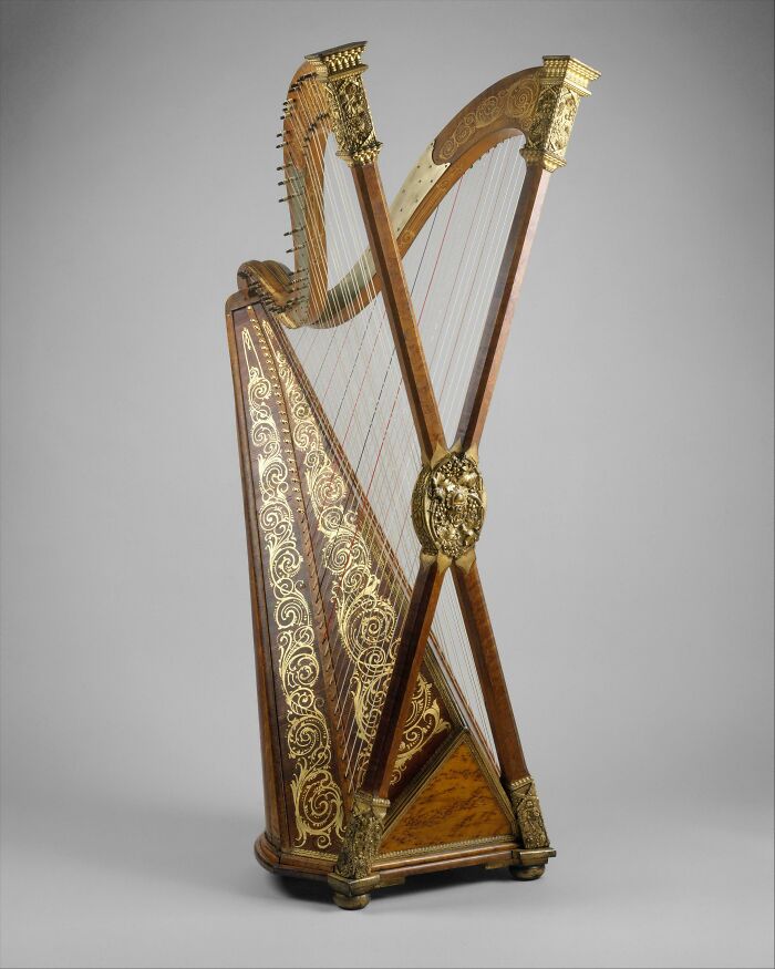 Antique harp with ornate gold decorations showing incredible discoveries