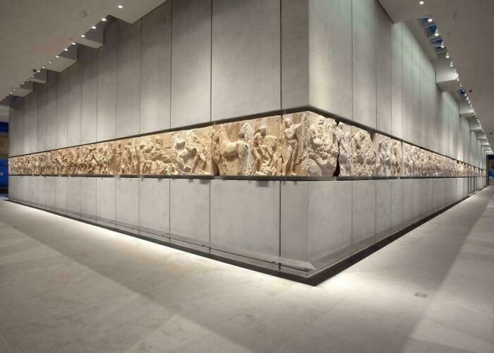 Museum display of ancient carved stone reliefs from historic discoveries