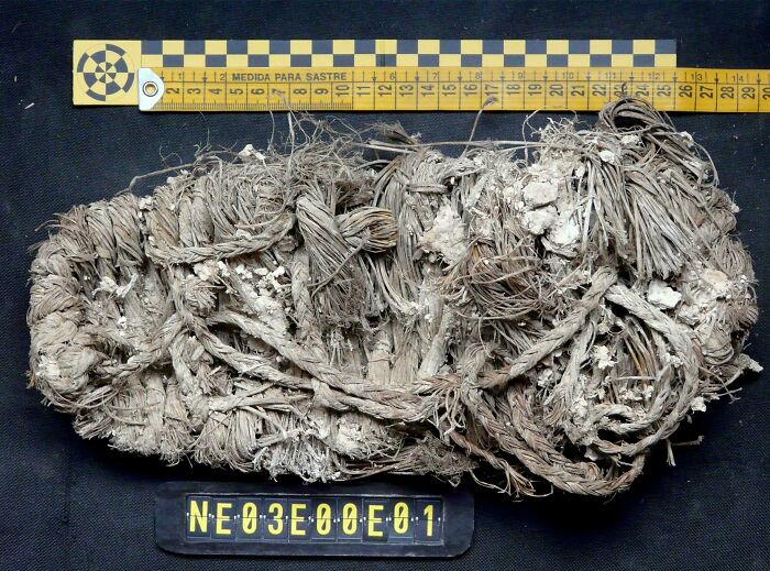 Ancient woven rope artifact discovery with measuring scale