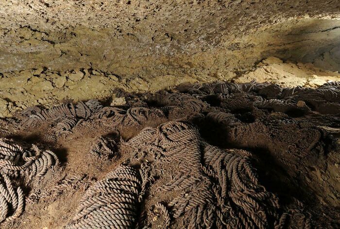 Archaeological discovery of ancient woven artifacts buried in cave soil layers