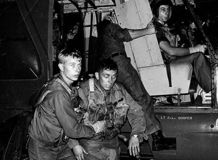 Emotional historical photos of soldiers evacuating from a helicopter, showing their raw emotions and the past.