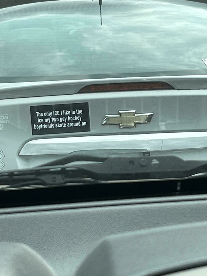 An unfiltered bumper sticker on a car that reads The only ICE I like is the ice my two gay hockey boyfriends skate around on.