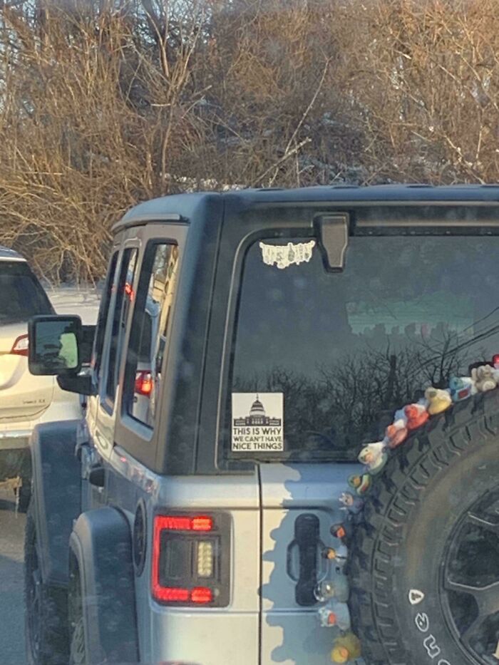 Funny bumper sticker on the back of a Jeep that says This is why we can't have nice things.