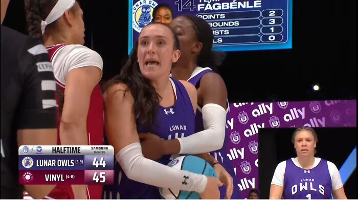 Basketball player appearing to float in midair, creating a misleading and confusing photo that seems like a real-life glitch.