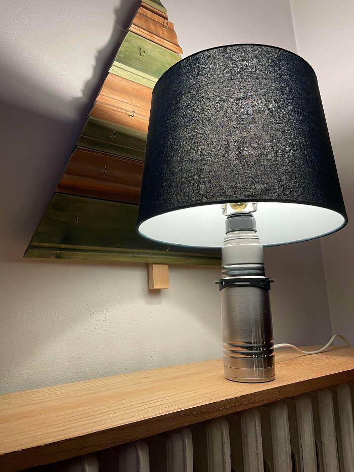 Homemade lamp made from a metal water bottle featured in questionable DIY projects.