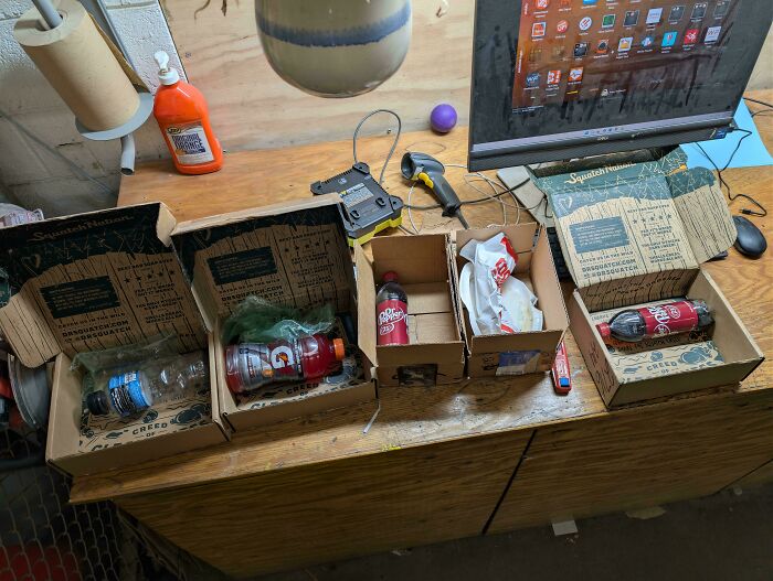 A messy desk setup with boxes and bottles, illustrating homedepot employees posts about store life