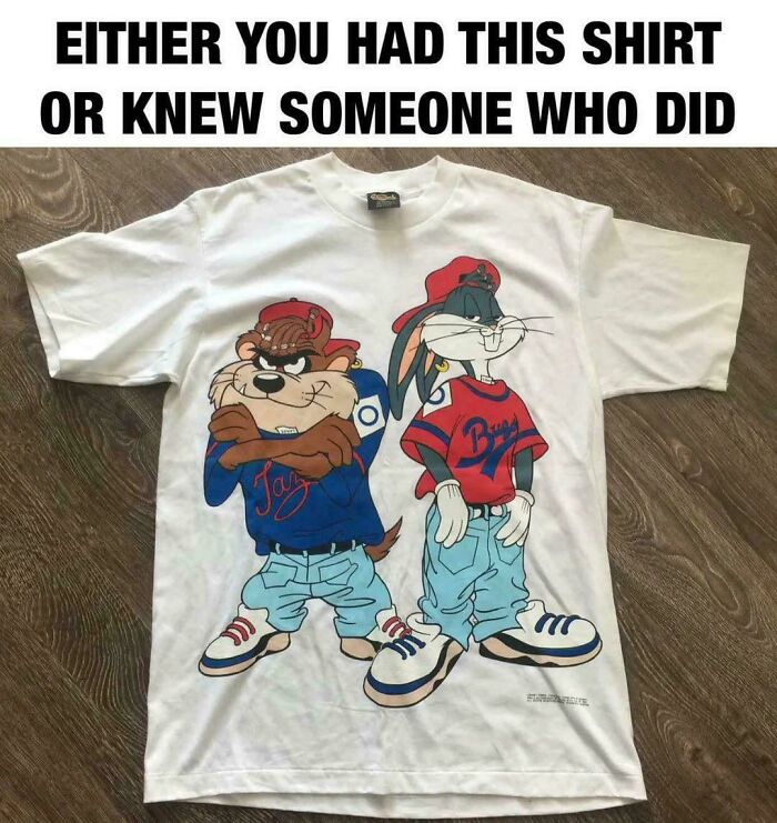 A '90s kid meme showing a vintage white T-shirt with Bugs Bunny and Taz wearing hip-hop clothes.