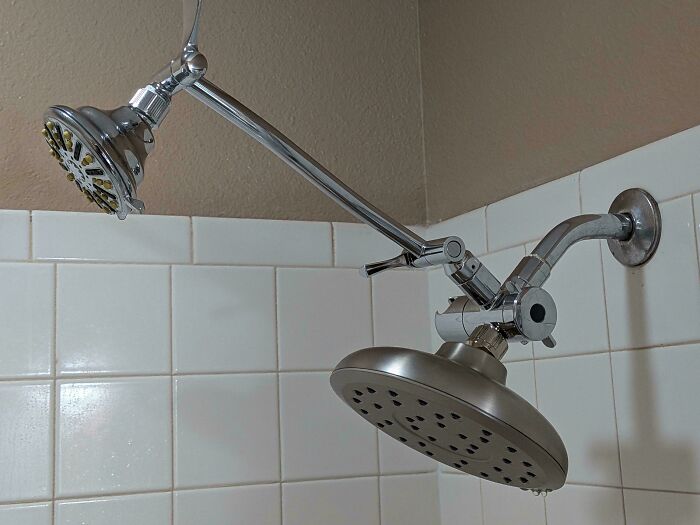 A dual shower head with a main rain-style head and an adjustable smaller head, a great addition for dads.