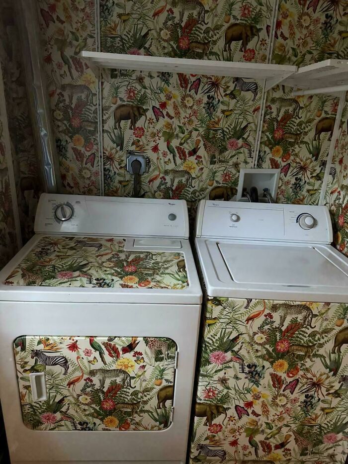 Washing machine and dryer decorated with matching wildlife patterned wallpaper and panels