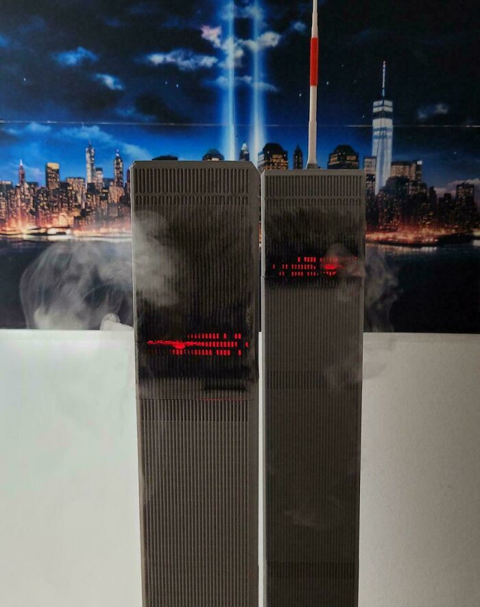 Model Twin Towers phone sculpture with city skyline and smoke effects