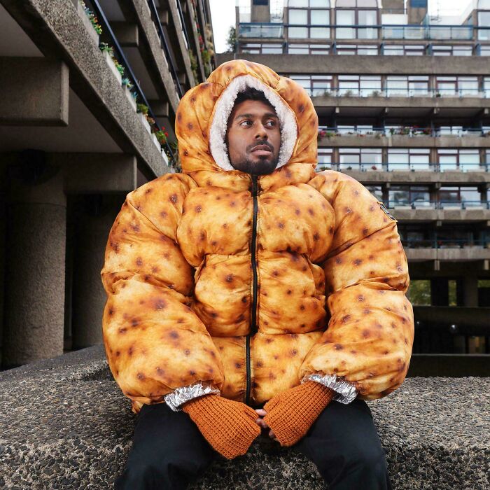 Man wearing puffy jacket designed to look like a giant cracker