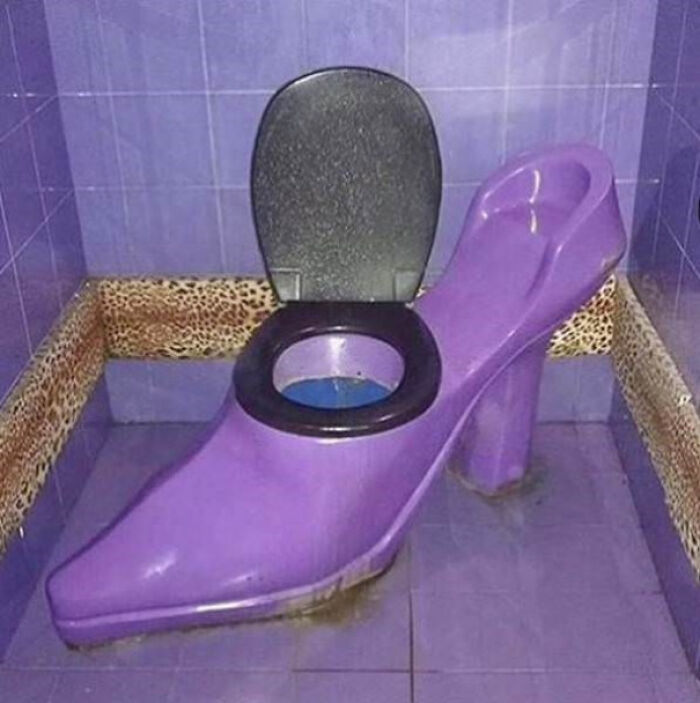 Purple high heel shoe toilet combining footwear and bathroom fixtures
