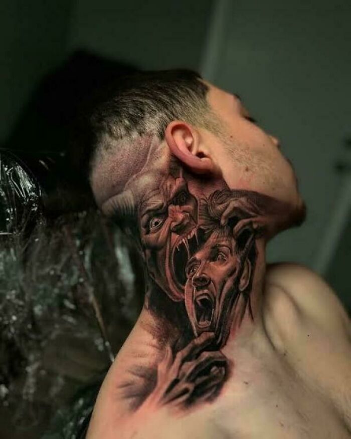 Realistic neck tattoo showing screaming faces in dark style