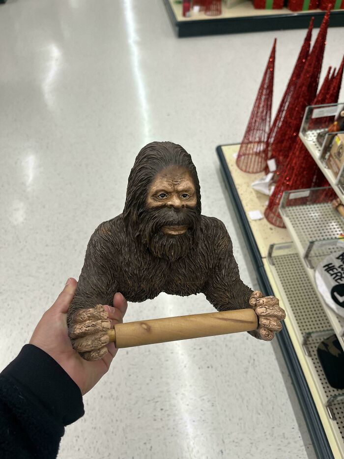 Bigfoot figure holding rolling pin with skillfully crafted design
