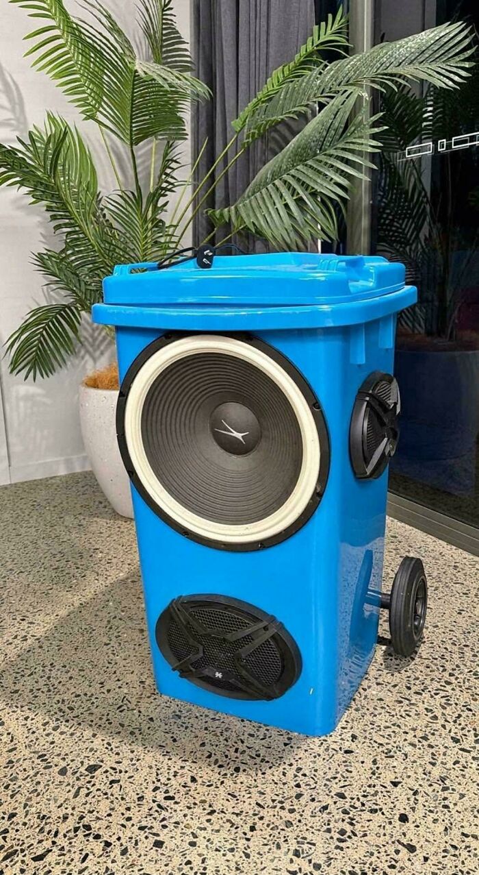 Blue trash bin converted into oversized speaker showing questionable skill use