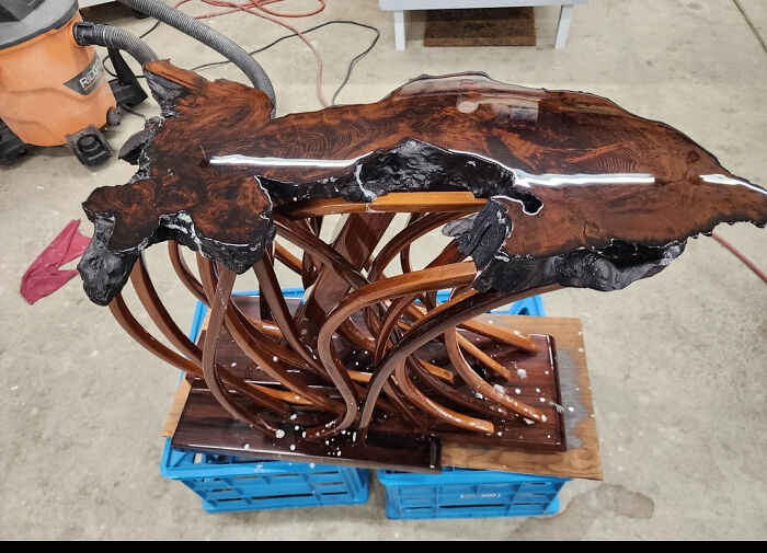 Artistic wooden table with twisted legs and polished top