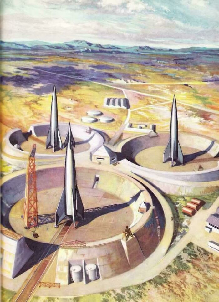 Retrofuturistic image of how people in the past imagined the future: three rockets on launchpads.