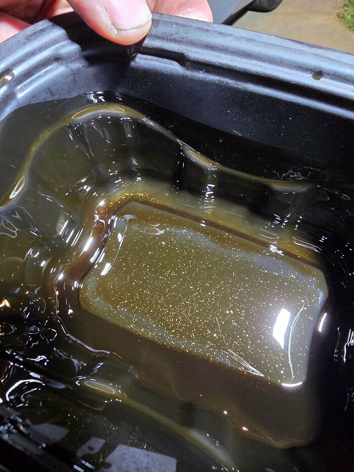 Car mechanics deal with engine oil containing metallic particles, an unusual issue.