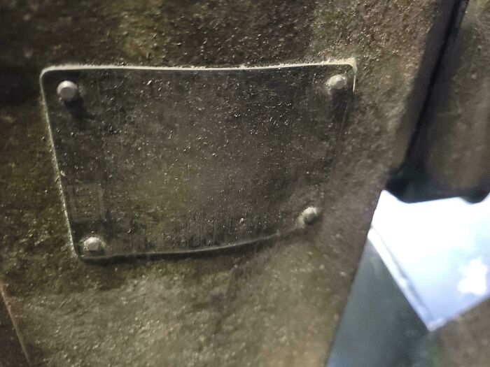 Car mechanics had to take pics of strange car issues, like this old, dirty metal plate.