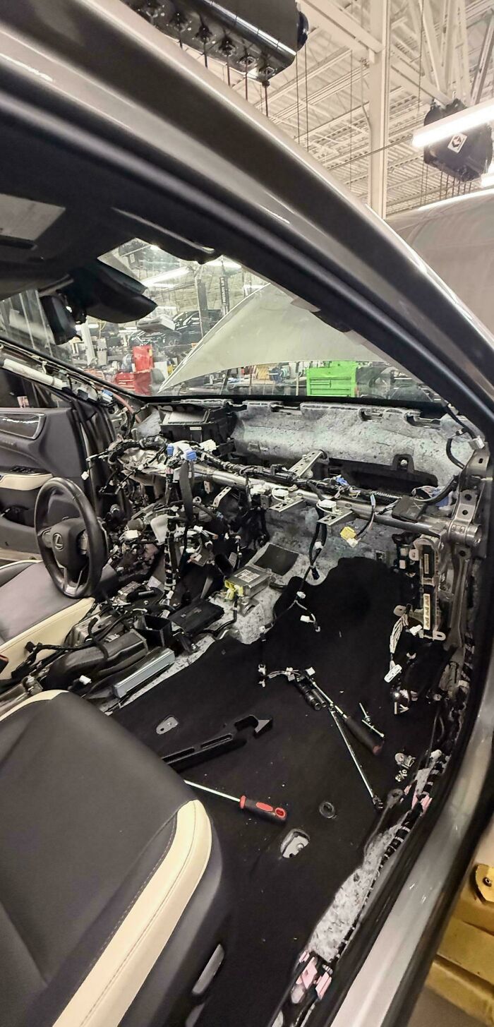 The interior of a car completely disassembled by car mechanics for extensive repairs.