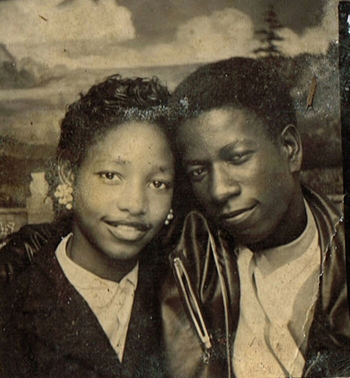 A candid old photo of a smiling couple, revealing what the world looked like generations ago.