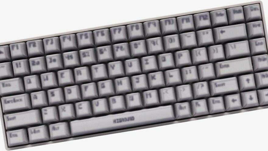 Blurred keyboard with unclear key labels, showcasing a design flaw that makes the device impossible to use properly.