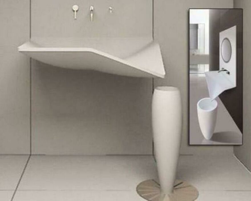 Unusable bathroom sink design with angled basin and tall, narrow pedestal making it impossible to use, highlighting design fails.