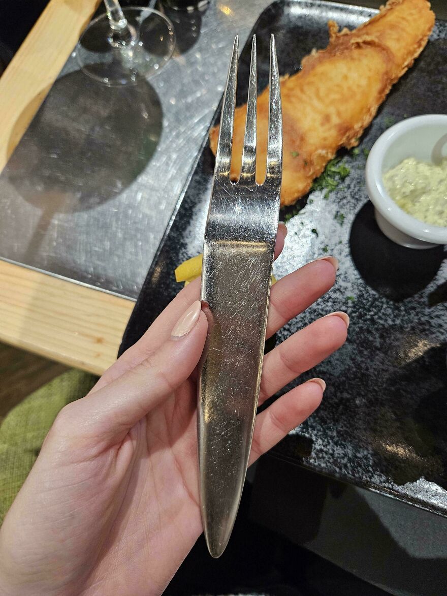 Fork and knife combined into one utensil, showcasing a designer fail that makes it impossible to use properly.
