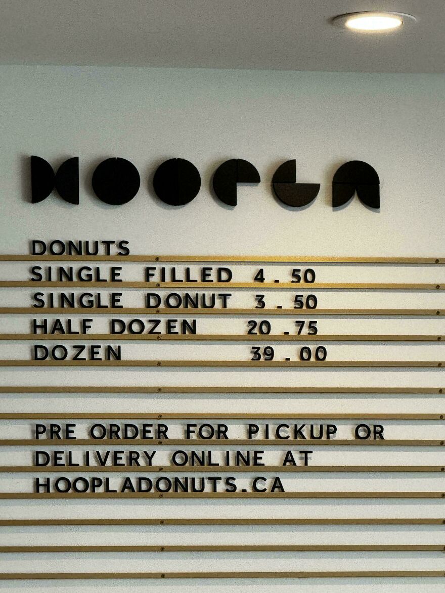 Confusing donut shop menu with difficult-to-read font and unclear pricing, showing designers going too far in usability.
