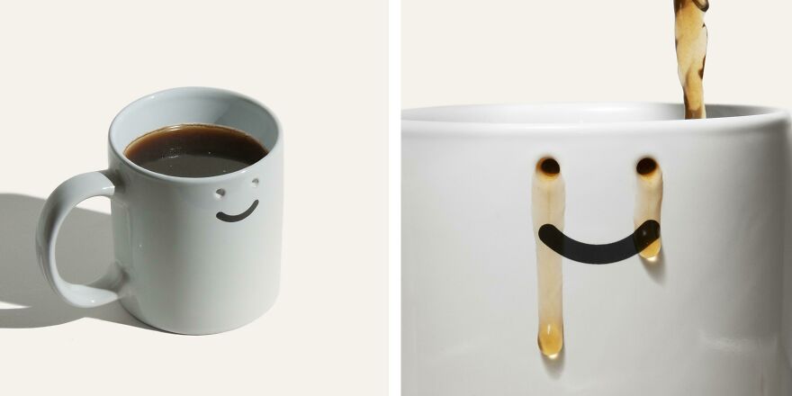 White coffee mug with a smiling face that becomes coffee stains, showcasing a design that is impossible to use.