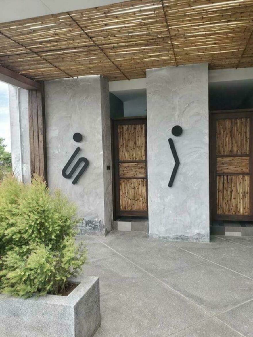 Restroom signs with confusing abstract icons making the bathroom impossible to identify, showing design gone too far.