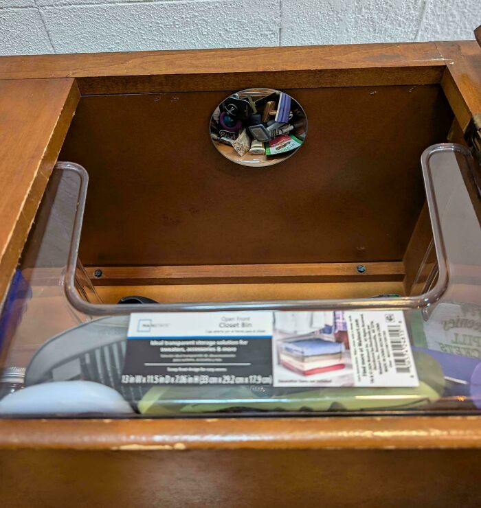 Small mirror placed inside a drawer to easily see and access items, a genius idea solving an annoying problem.