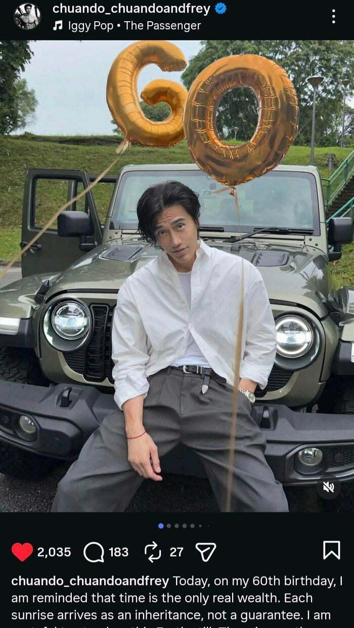 Amazing photo of a man posing in front of a Jeep with 60 balloons, an image that might brighten your day.