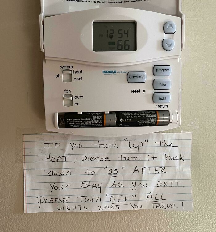 Thermostat with a handwritten note using suspicious punctuation around words like up, 55, and off in quotation marks.