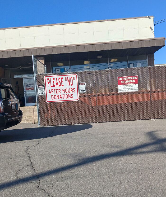 Sign with suspicious quotation marks around the word no, warning against after hours donations at a donation drop-off center.