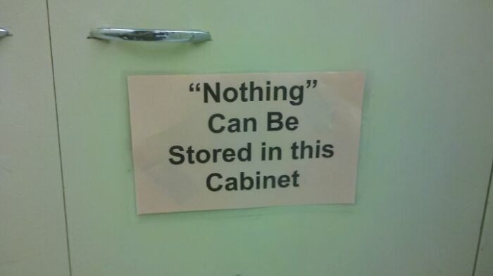 Sign with suspicious quotation marks around the word nothing, making the storage rule sound hilariously doubtful on cabinet door.