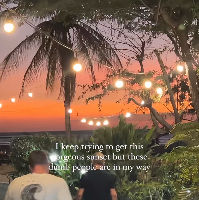 People blocking a sunset view with palm trees and string lights, illustrating cringy influencer behavior outdoors.
