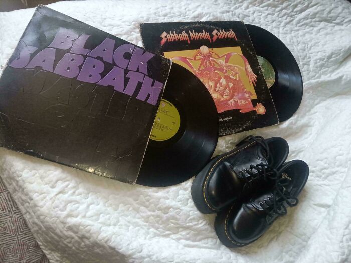 Two Black Sabbath vinyl records and a pair of black boots, a cool haul from dumpster diving.
