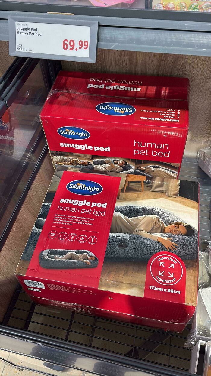 Human pet beds displayed in a store aisle, one of 116 mildly interesting pictures.