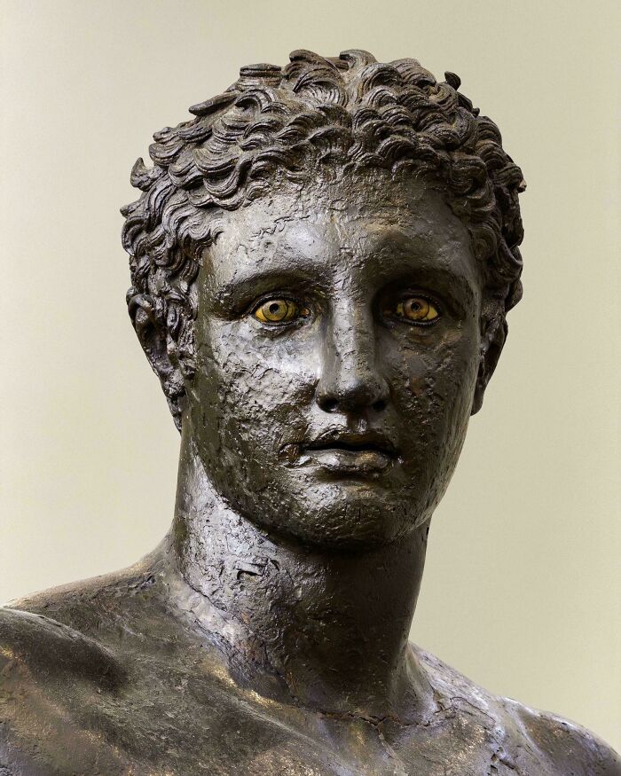 Ancient bronze bust with striking inlaid eyes, an example of remarkable historical finds.