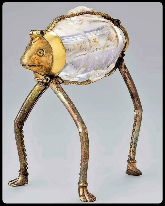 An ornate frog-shaped crystal container with golden legs, showcasing unique historical finds.