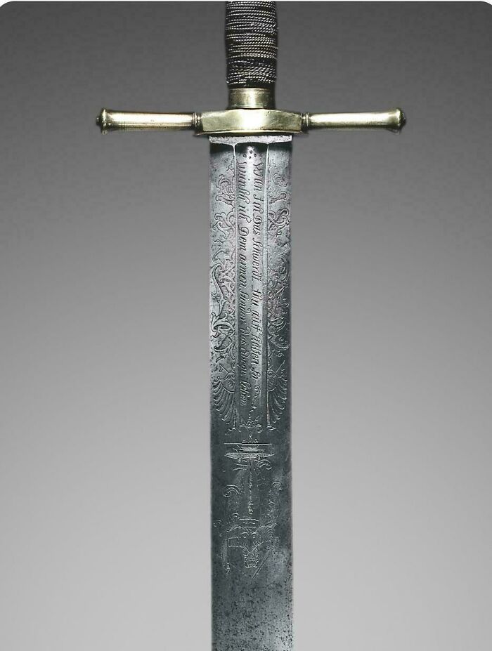 Close up of an intricately engraved historical sword blade featured among historical finds.