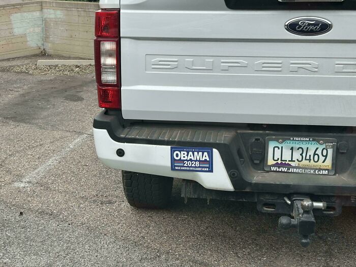 An unfiltered bumper sticker on a white Ford truck showing support for Obama 2028, sparking drivers to do a double take.