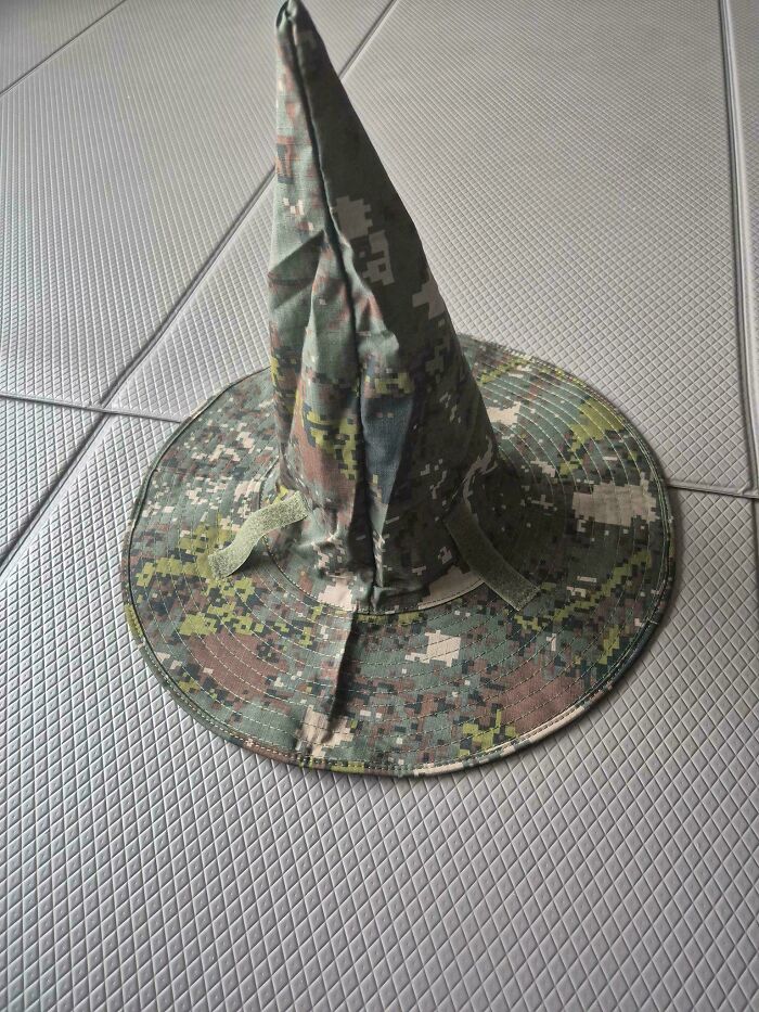 Peculiar things people spotted in real life: a camouflage bucket hat folded into a witch hat.