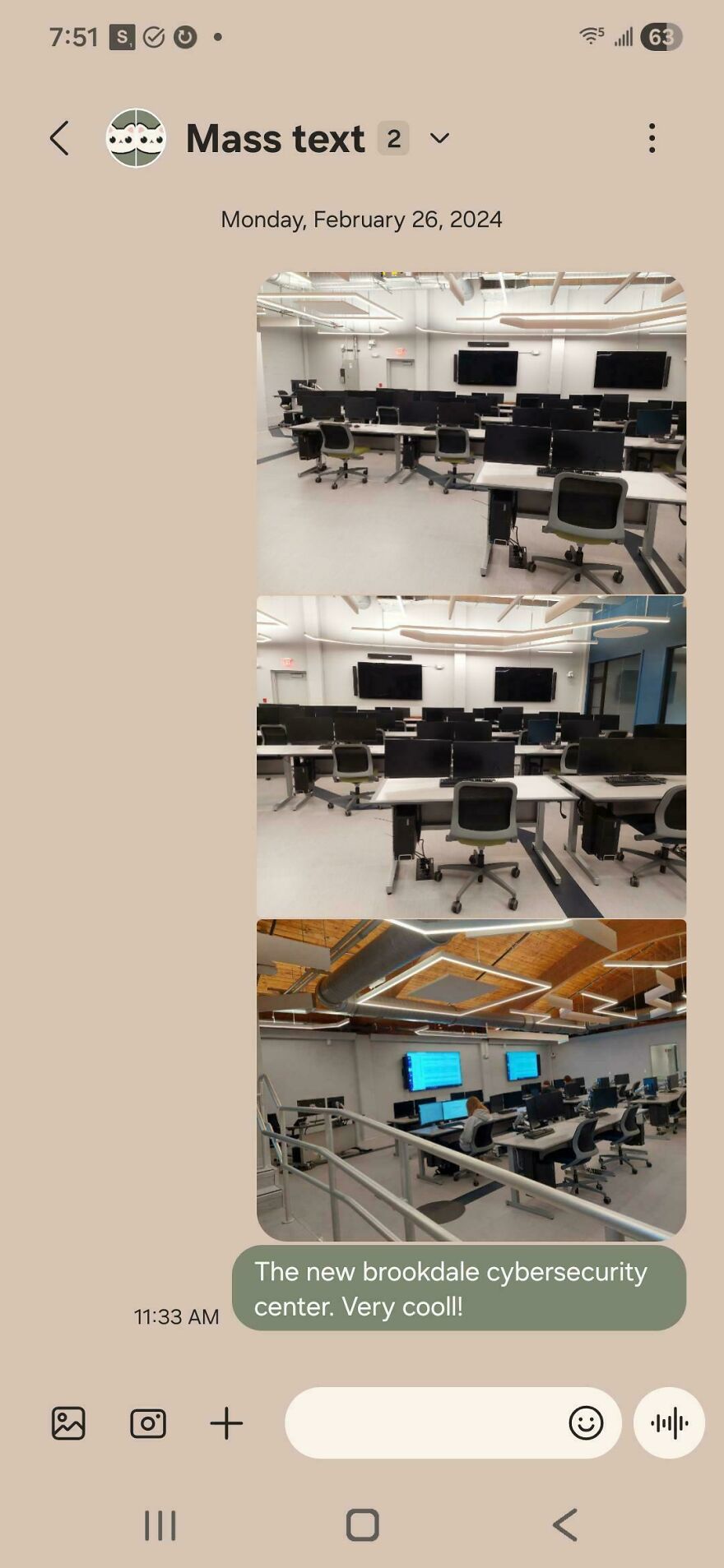 Empty cybersecurity center with multiple desks, computer monitors, and modern lighting in a clean office space.