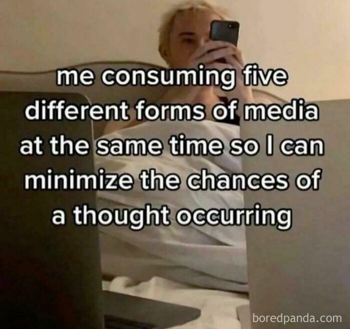 Person lying in bed using multiple devices with meme text about consuming different media, illustrating funny and relatable memes.