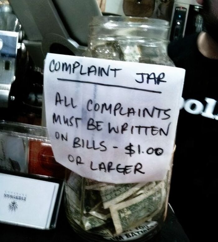 Complaint jar with a humorous note requiring $1 bills for complaints, a funny sign that made people laugh or do a double take.