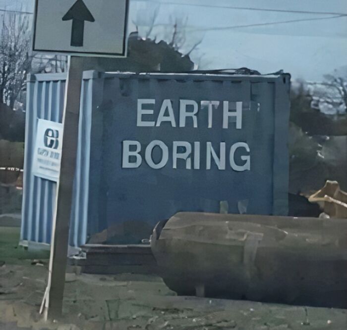 Sign on a container reading Earth Boring, a humorous and clever sign that might make people laugh or do a double take.