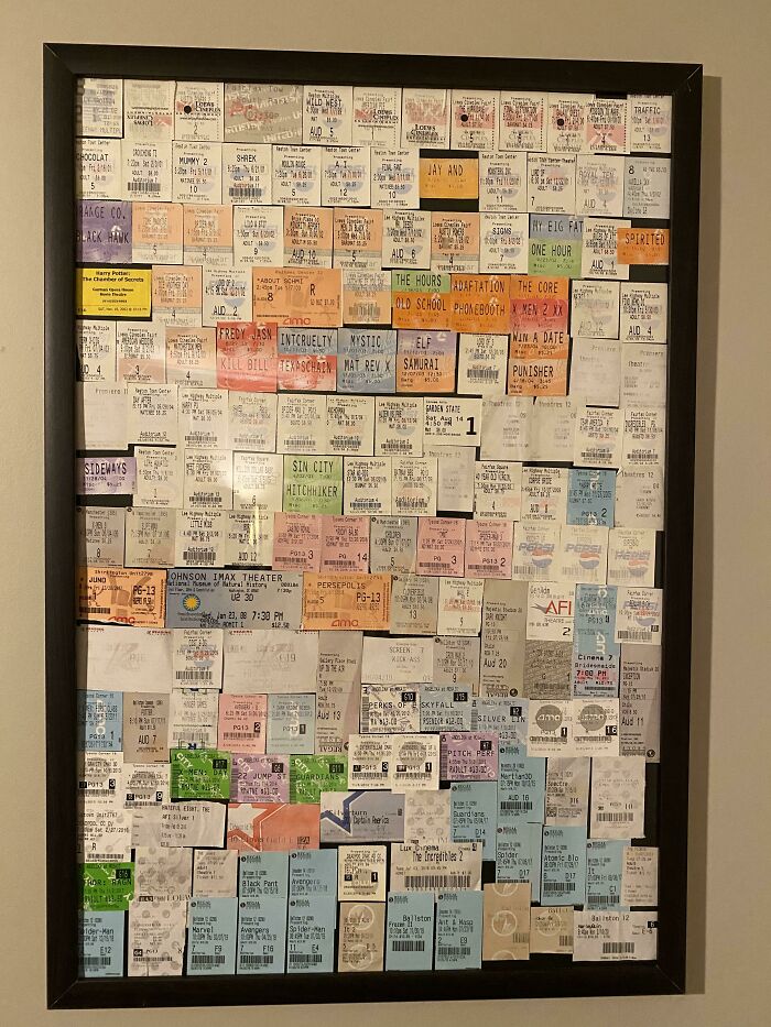 Collection of movie ticket stubs displayed in a frame showing an obsession that grew into a collection.
